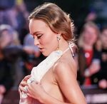 Braless Lily-Rose Depp Prevents Nip Slip Wardrobe Malfunctio